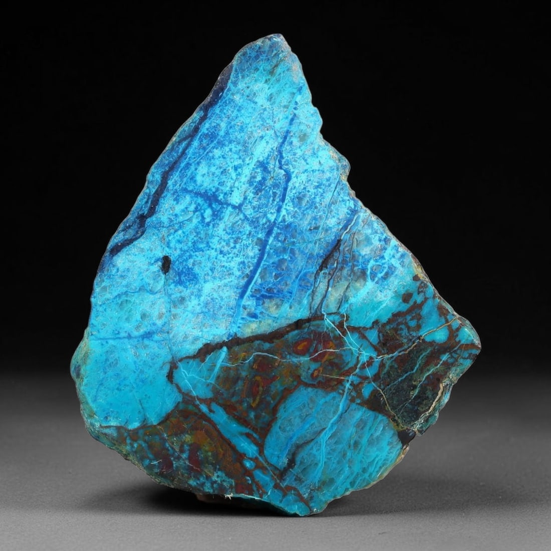 110ct Natural Peruvian Chrysocolla Polished Slab Rough, 62AR: This partial-polished chrysocolla slab features blended mineral matrix with smooth refined face and unaltered natural rugged edge across its 43x37x8mm elongated form, translucent mineral layers hold s