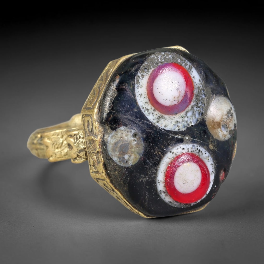 Antique Islamic Millefiori Evil Eye Glass Cabochon Set Vintage Signet Ring (1700-1900 CE), 9AN: The primary collectible value resides within the inset antique millefiori evil-eye glass cabochon, authentic genuine antique glass (distinguished from earlier ancient glass and modern vintage glass) c