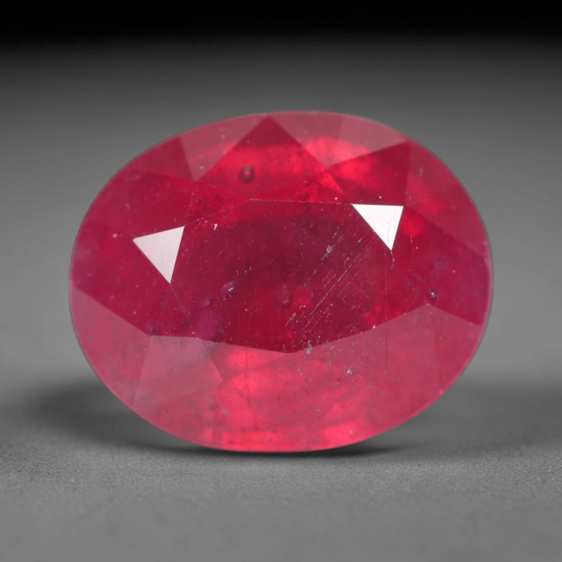 5.39ct Natural Madagascar Vivid Magenta Red Ruby Loose Gemstone, 38BA: This vivid magenta-hued Madagascar ruby boasts rich saturated red-pink saturation scattered with tiny fine mineral specks and distinct two-phase fluid bubble inclusions throughout its translucent crys