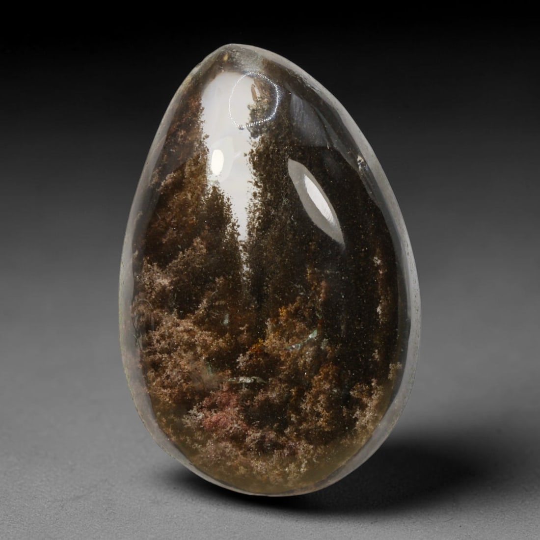 19ct Natural Brazilian Phantom Quartz Oval Cabochon Loose Gemstone, 66BM: This smoothly polished cabochon of natural phantom quartz preserves delicate layered phantom crystal formations enclosed inside transparent quartz host. The domed polished surface offers unobstructed 