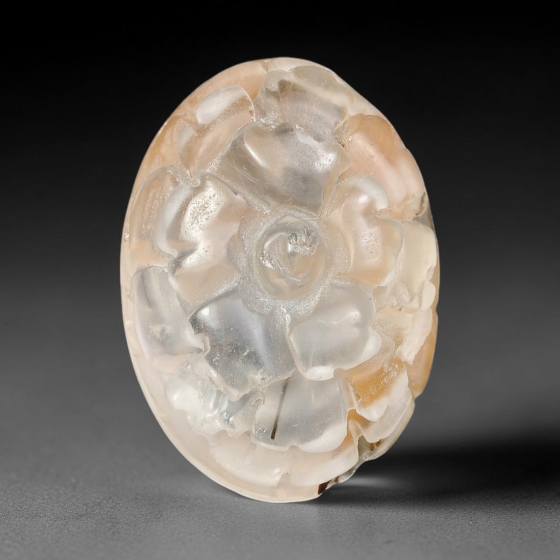 Natural Brazilian Phantom Quartz Hand Carved Floral Gemstone, 98BQ: This hand-carved floral specimen is crafted from natural phantom quartz. Intricate layered floral detailing wraps across the stone's surface, while translucent quartz matrix reveals subtle internal ph