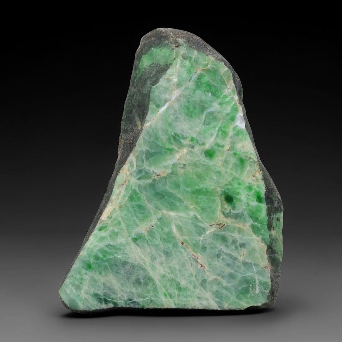175ct Natural Type A Burmese Jadeite Jade Sliced Rough, 10AZ: This specimen is a sliced rough block of natural Type A Burmese jadeite jade. The interior displays natural colour zoning with visible mineral veining and crystalline patterns typical of unprocessed j