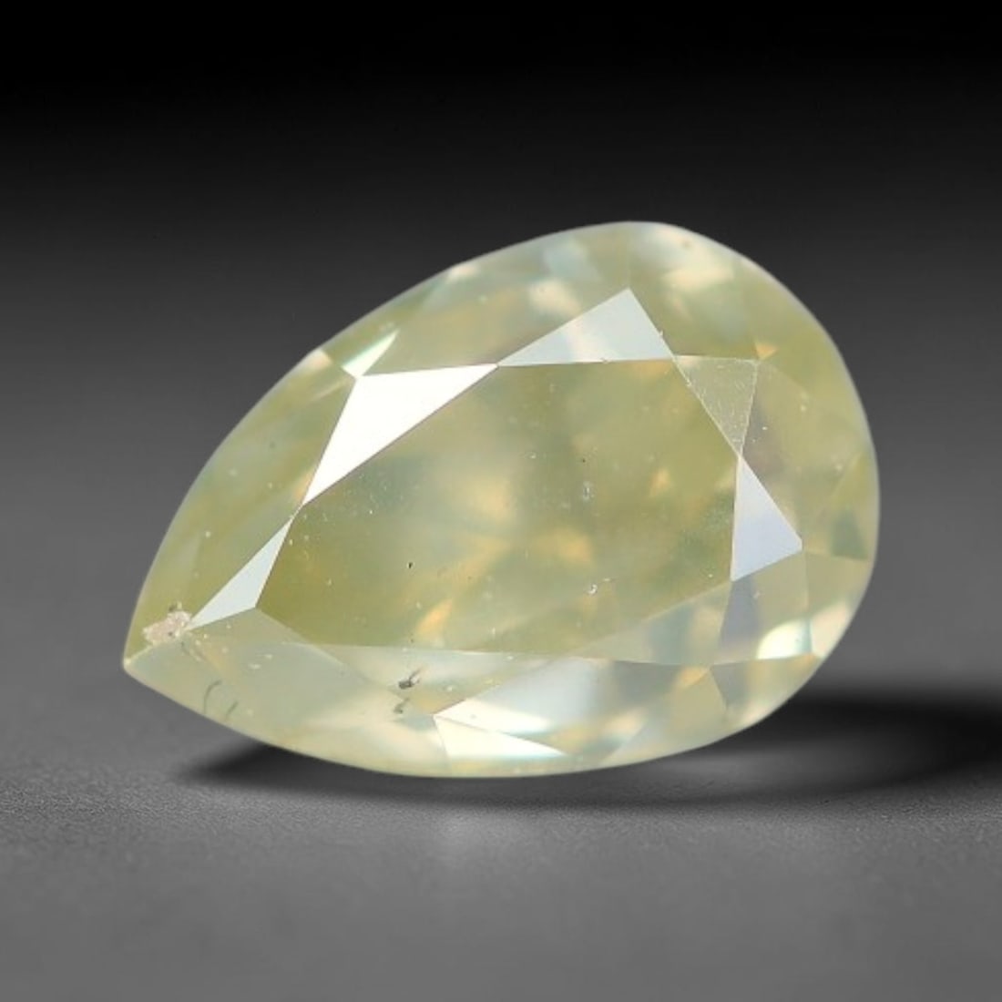 0.41ct Untreated Natural Fancy Diamond Loose Gemstone, 79BH: This fully polished untreated natural fancy diamond features inherent internal mineral markings characteristic of natural diamond formation, measured at calibrated dimensions of 5x3.4x2.8mm. Precision