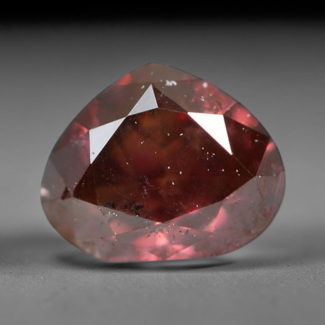 0.30ct Natural Fancy Pinkish Purple Diamond Loose Gemstone, 23BG: This polished natural diamond displays rich pinkish-purple body saturation, with subtle fine microscopic mineral specks distributed within its crystal interior, measured at calibrated dimensions of 4.