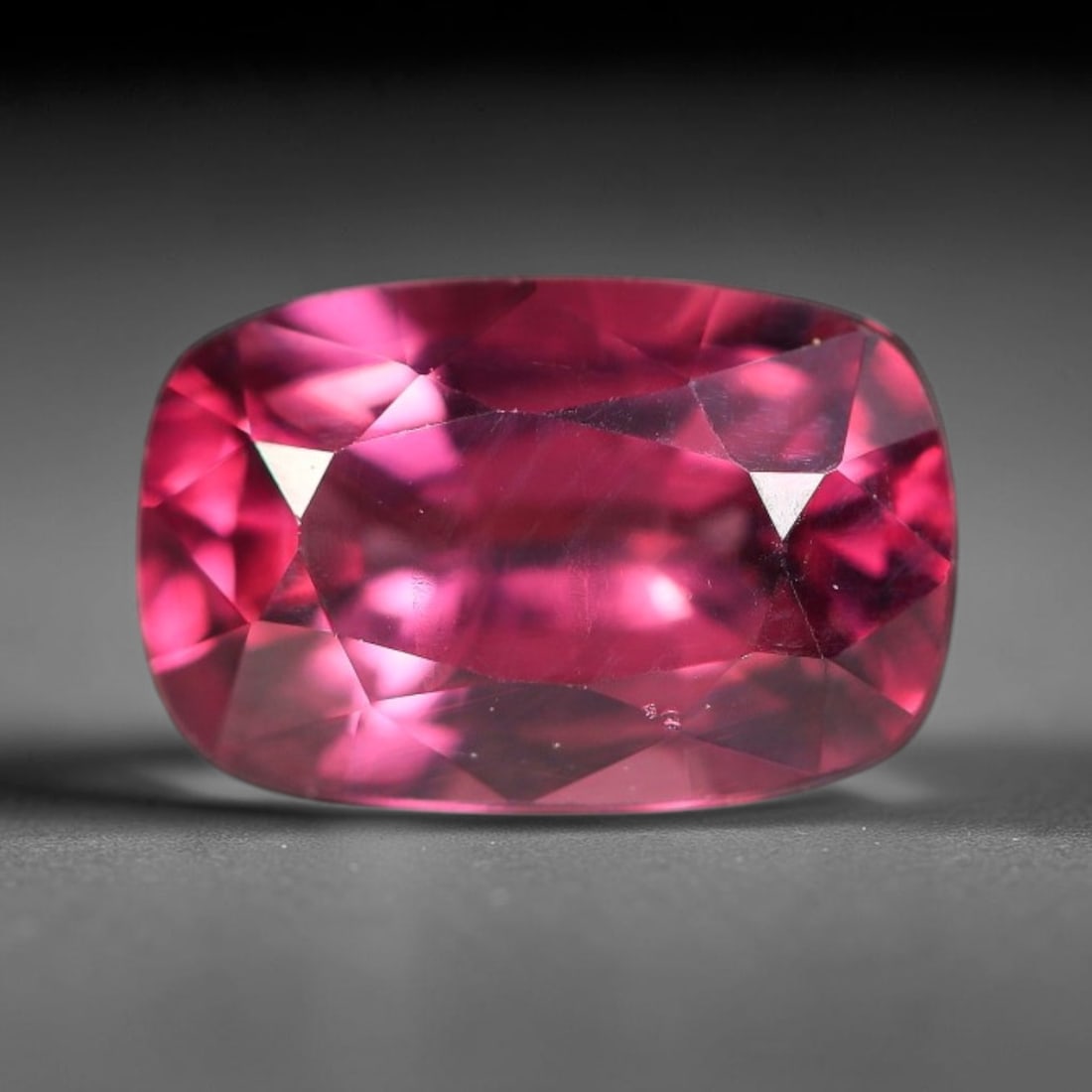 1.35ct Natural Tanzanian Rhodolite Garnet Loose Gemstone, 9BW: This natural rhodolite garnet originates from Tanzania, featuring well finished faceting that enhances light performance within the transparent crystal. Dimensions measure 7.8x5.1x3.6mm, fully polishe