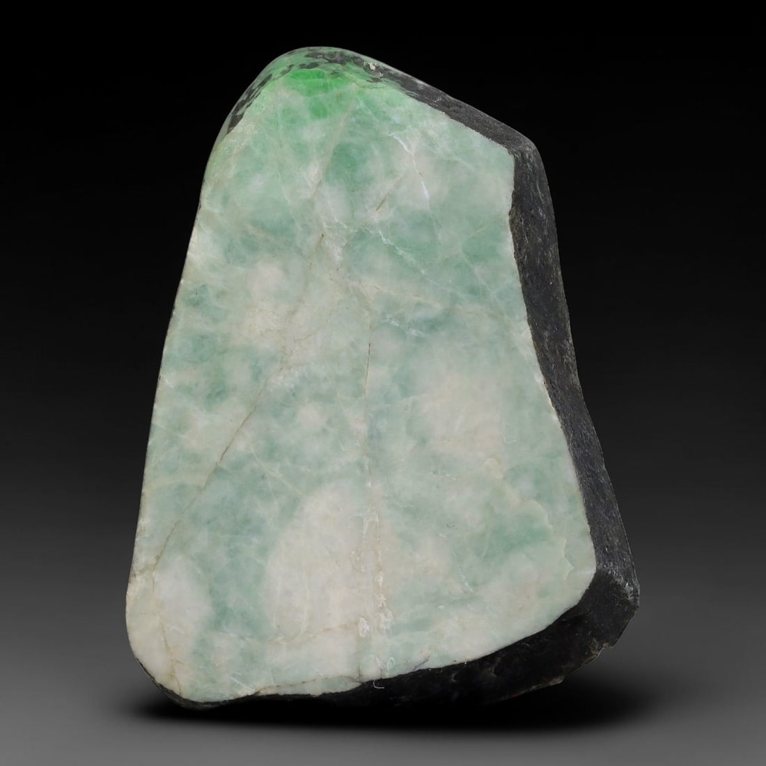 280ct Natural Type A Burmese Jadeite Jade Sliced Rough, 53AZ: This specimen is a sliced rough block of natural Type A Burmese jadeite jade. The interior displays natural colour zoning with visible mineral veining and crystalline patterns typical of unprocessed j