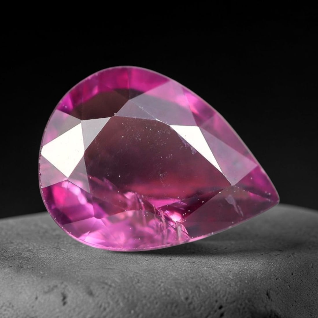 1.22ct Natural Tanzanian Rhodolite Grape Garnet Faceted Loose Gemstone, 9BE: This expertly faceted grape garnet, a scarce saturated purple-magenta rhodolite variant, features transparent crystal structure dotted with faint microscopic mineral specks within its precisely cut re