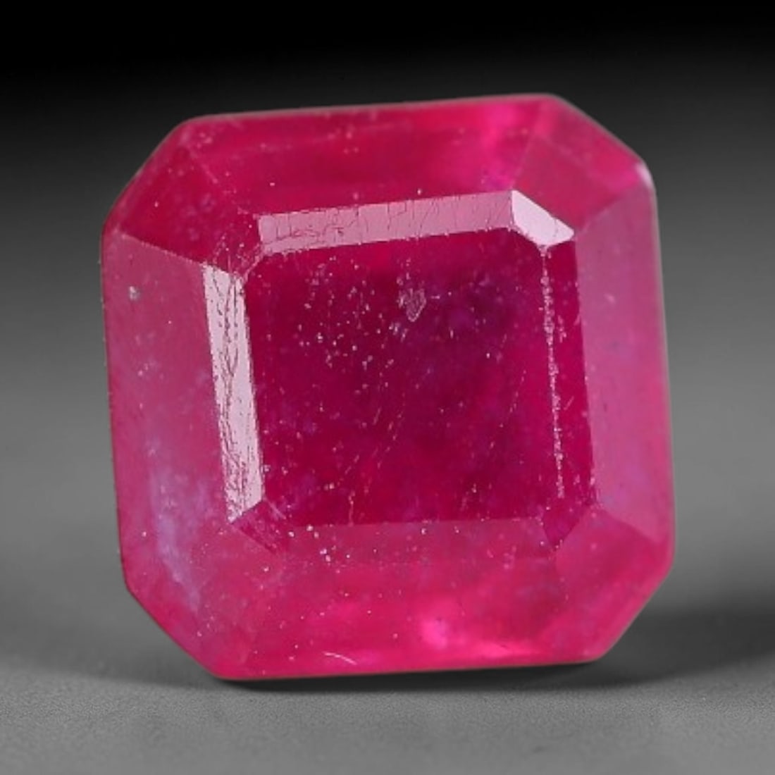 1.57 Carats Natural Madagascar Vivid Fuchsia Red Heated Ruby Loose Gemstone, 46FM: This vivid fuchsia red Madagascar ruby displays rich saturated red tone with subtle natural internal mineral traces that showcase genuine earth-grown character, measured at 6x4mm, the intense warm cri