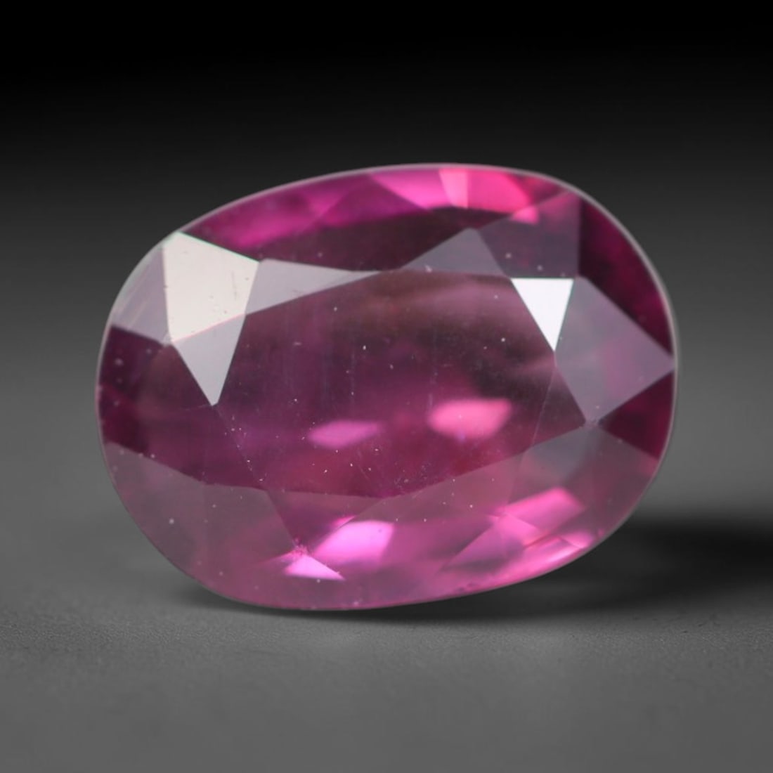1.42ct Natural Tanzanian Rhodolite Grape Garnet Faceted Loose Gemstone, 89BA: This expertly faceted grape garnet, a scarce saturated purple-magenta rhodolite variant, features transparent crystal structure dotted with faint microscopic mineral specks within its precisely cut re
