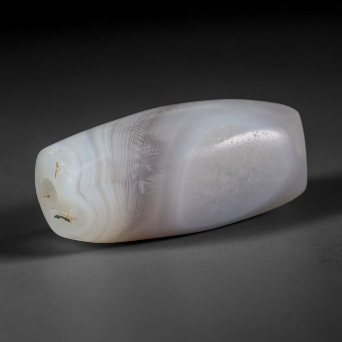 Ancient Elamite Civilization Banded Agate Barrel Bead (3200-539 BCE), 40AD: This antique banded agate barrel bead originates from the Elamite Civilization, an independent Southwest Iranian culture with distinctive agate bead craft traded widely with Indus and Mesopotamian civ