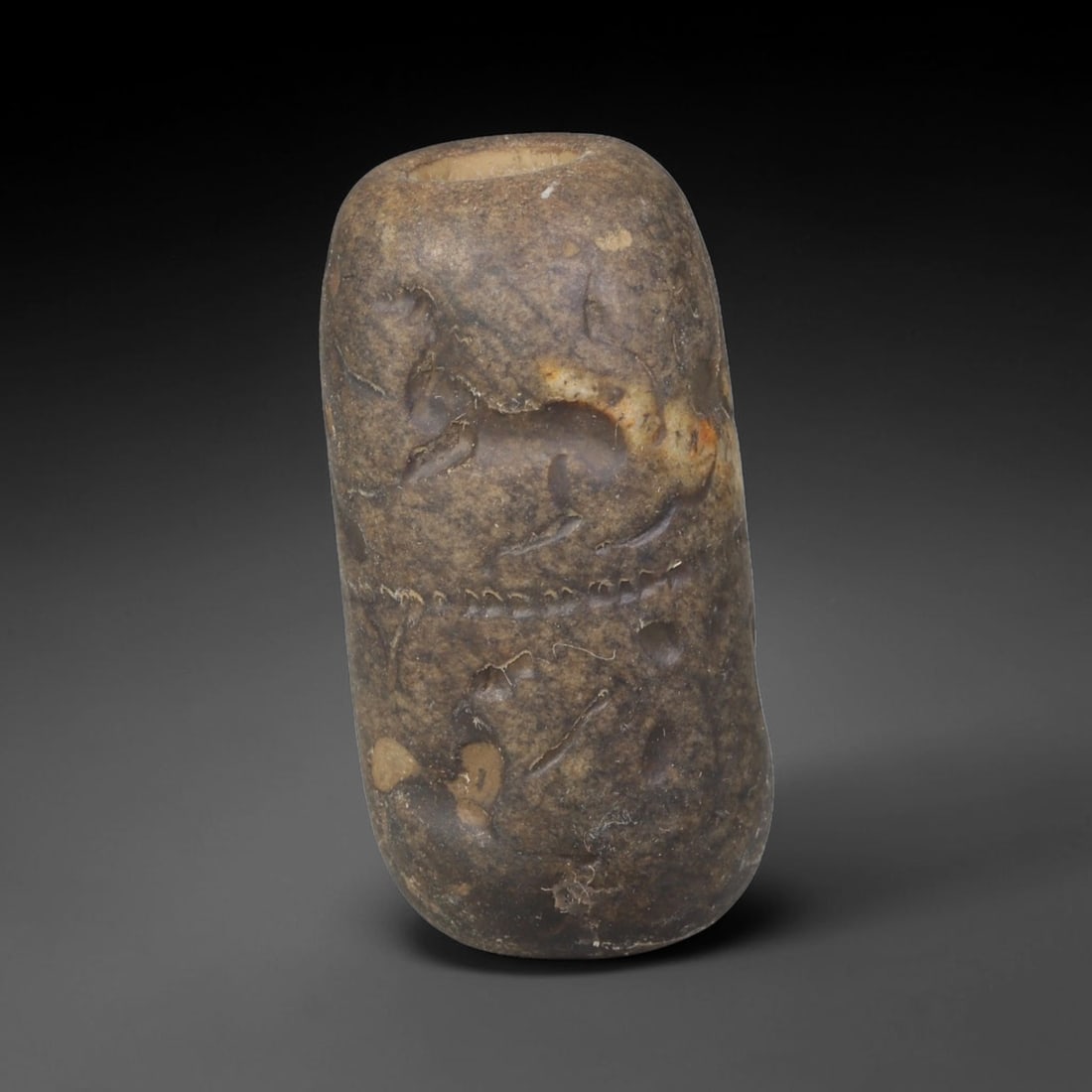 Ancient Sasanian Persian Carved Stone Cylinder Amulet (224-651 CE), 47EF: This antique carved stone cylinder amulet originates from the Sasanian Persian Empire, famed for zoomorphic talismanic carvings crafted for personal protection across late antique Western Asia. The da