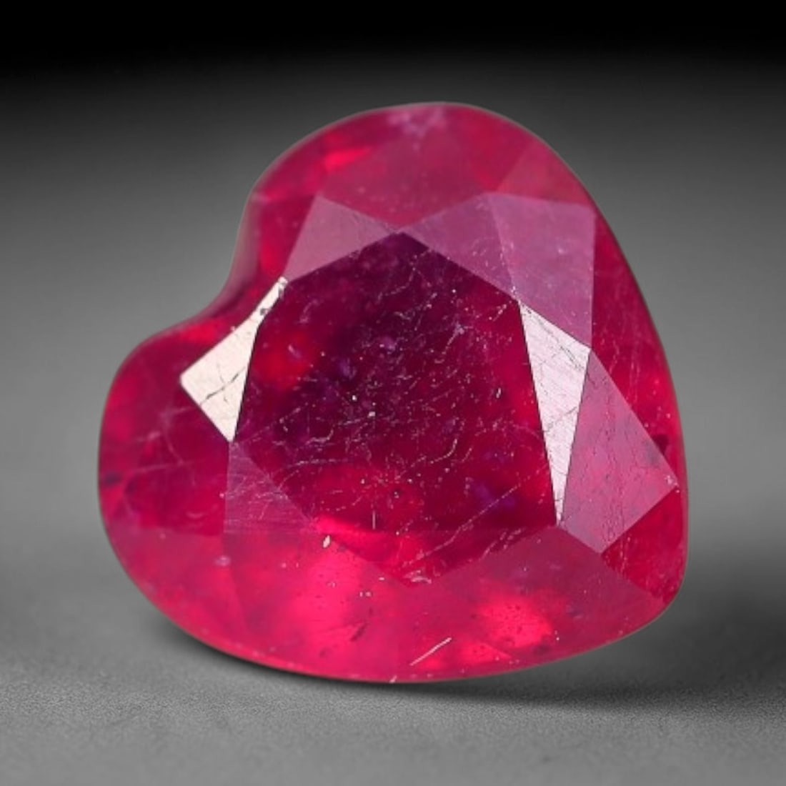 1.67 Carats Natural Madagascar Vivid Fuchsia Red Heated Ruby Loose Gemstone, 41FM: This vivid fuchsia red Madagascar ruby displays rich saturated red tone with subtle natural internal mineral traces that showcase genuine earth-grown character, measured at 7x4.1mm, the intense warm c