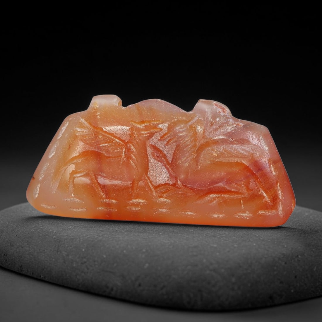 Vintage Natural Carnelian Agate Revival Indo-Persian Glyptic Figural Talisman Amulet Plaque, 44FL: This vintage talisman pendant plaque is skillfully carved from natural banded carnelian agate, crafted in a style referencing ancient Indo-Persian glyptic art traditions. The face bears detailed relie