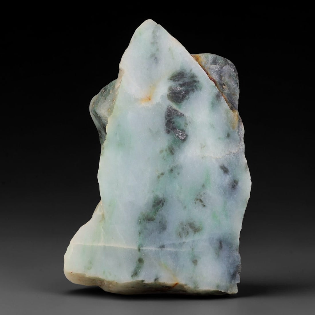 545ct Natural Type A Burmese Jadeite Jade Sliced Rough, 62FB: This specimen is a sliced rough block of natural Type A Burmese jadeite jade. The interior displays natural colour zoning with visible mineral veining and crystalline patterns typical of unprocessed j