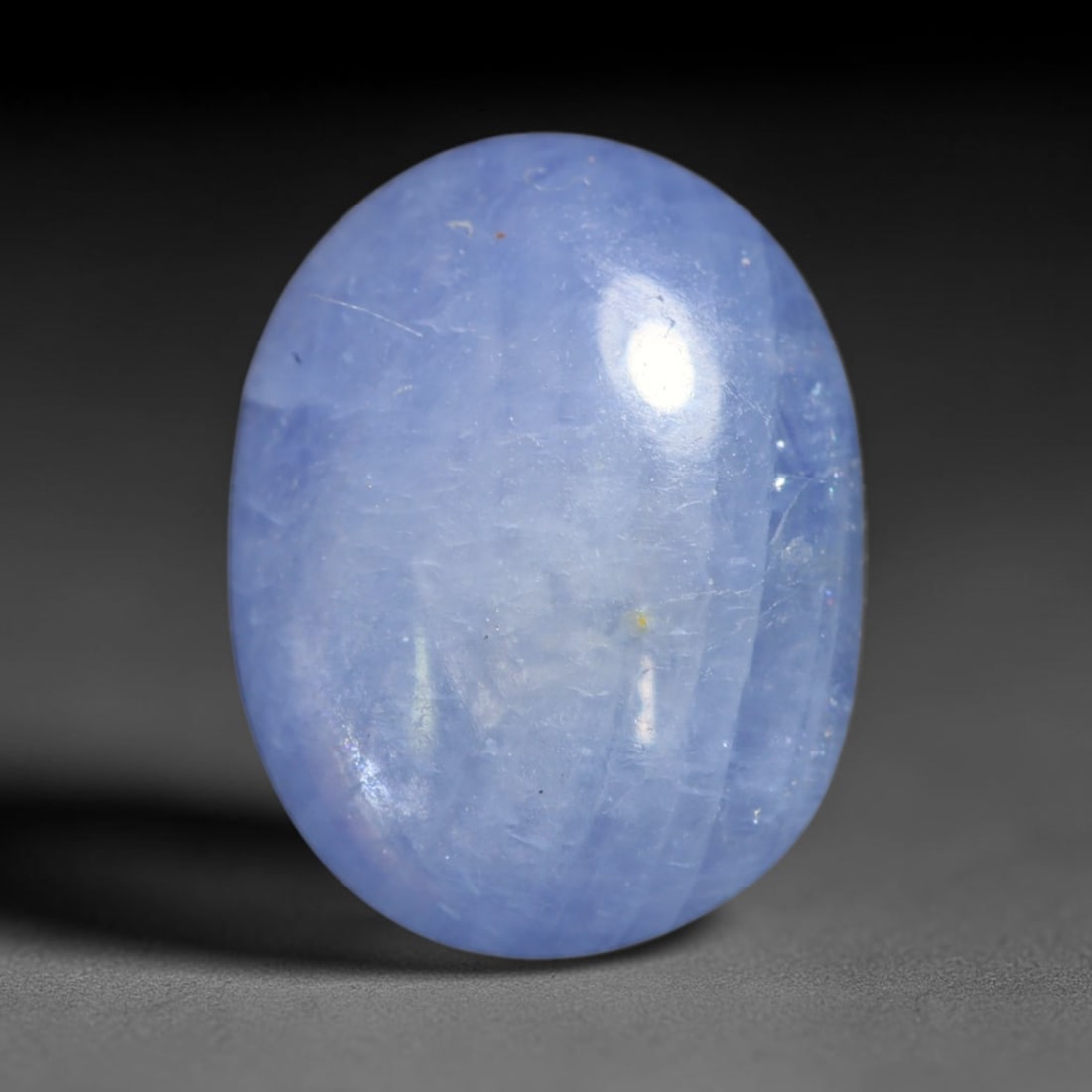 4.37ct Natural Unheated Burmese Blue Star Sapphire Oval Cabochon Loose Gemstone, 50BQ: This smoothly polished oval cabochon features natural Burmese blue star sapphire, formed with densely aligned rutile needle inclusions required to produce asterism. The gently domed surface is expertl