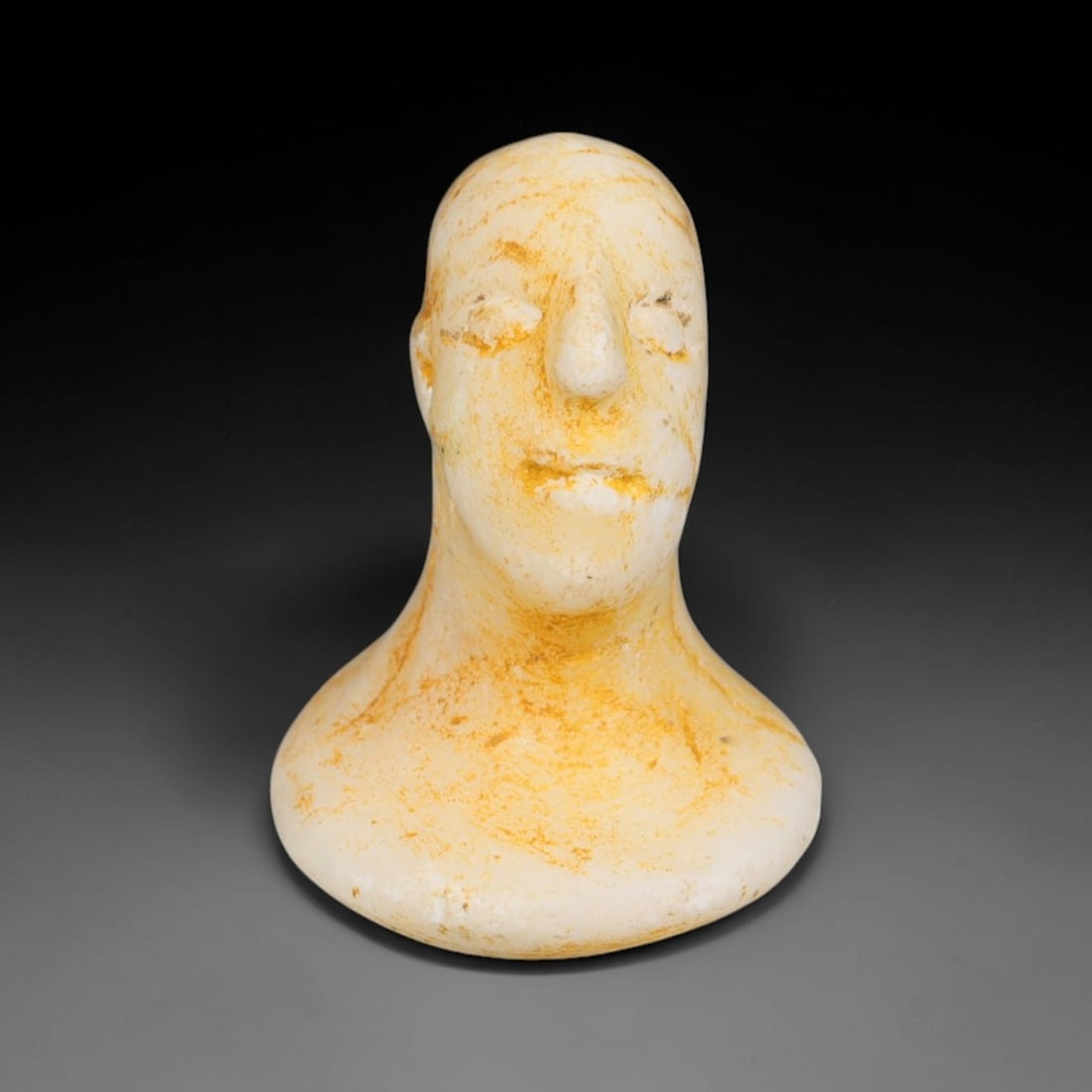 Ancient Bactrian Marble Idol Head (250 BCE-200 CE), 4EF: This carved pale marble idol head originates from Greco-Bactrian Culture, a significant Silk Road civilization blending Hellenistic and Central Asian artistic traditions. The simplified facial feature
