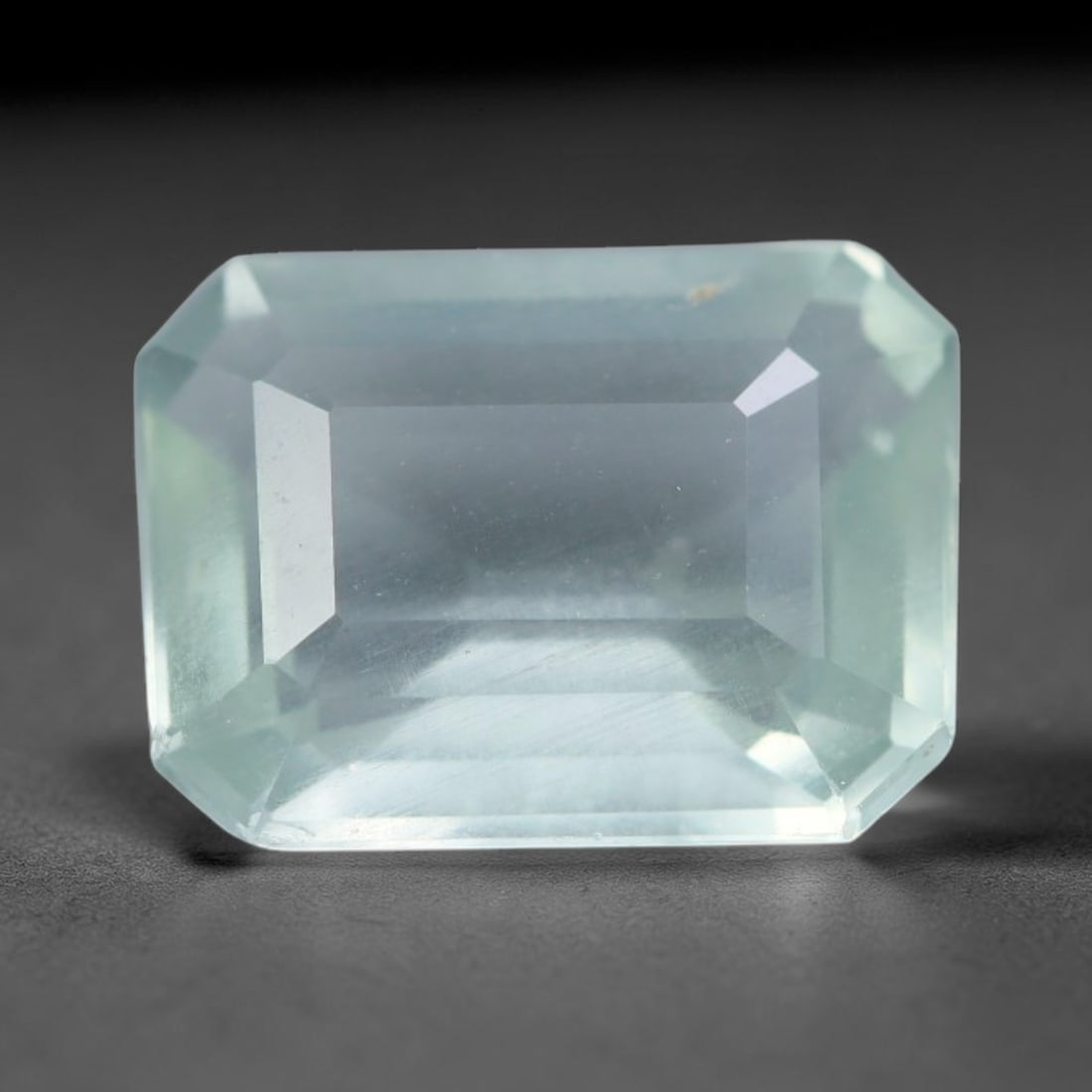 2.06 Carats Natural Brazilian Soft Sky Blue Aquamarine Loose Gemstone, 42AG: This serene sky blue aquamarine carries smooth icy pale blue saturation with gentle light refracting across its polished facets, measured at 9.6x7.3x4.1mm, its cool tranquil tone lends effortless eleg