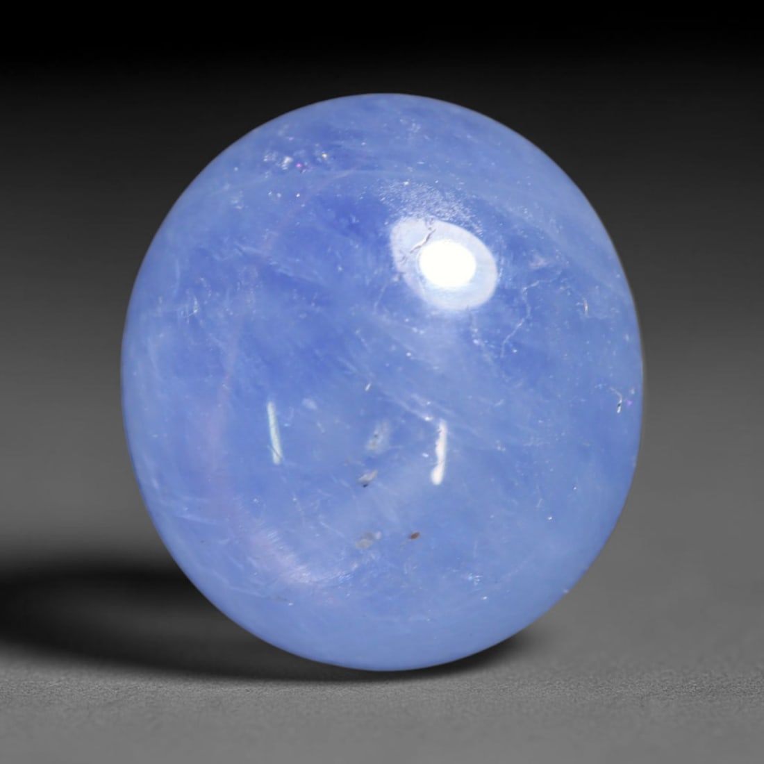 5.60ct Natural Unheated Burmese Blue Star Sapphire Oval Cabochon Loose Gemstone, 61BQ: This smoothly polished oval cabochon features natural Burmese blue star sapphire, formed with densely aligned rutile needle inclusions required to produce asterism. The gently domed surface is expertl