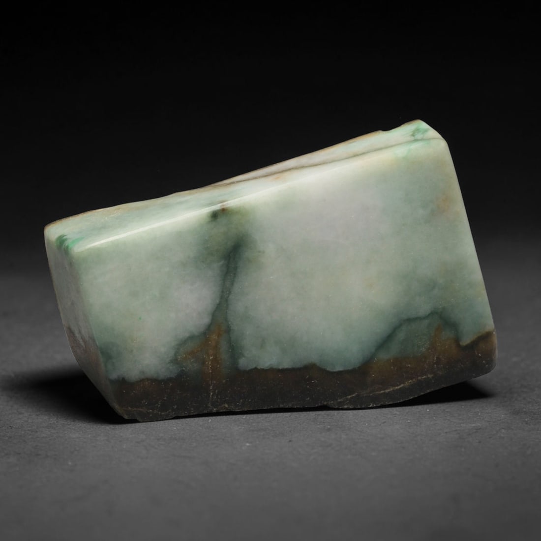 590ct Natural Type A Burmese Jadeite Jade Sliced Rough, 88EF: This specimen is a sliced rough block of natural Type A Burmese jadeite jade. The interior displays natural colour zoning with visible mineral veining and crystalline patterns typical of unprocessed j