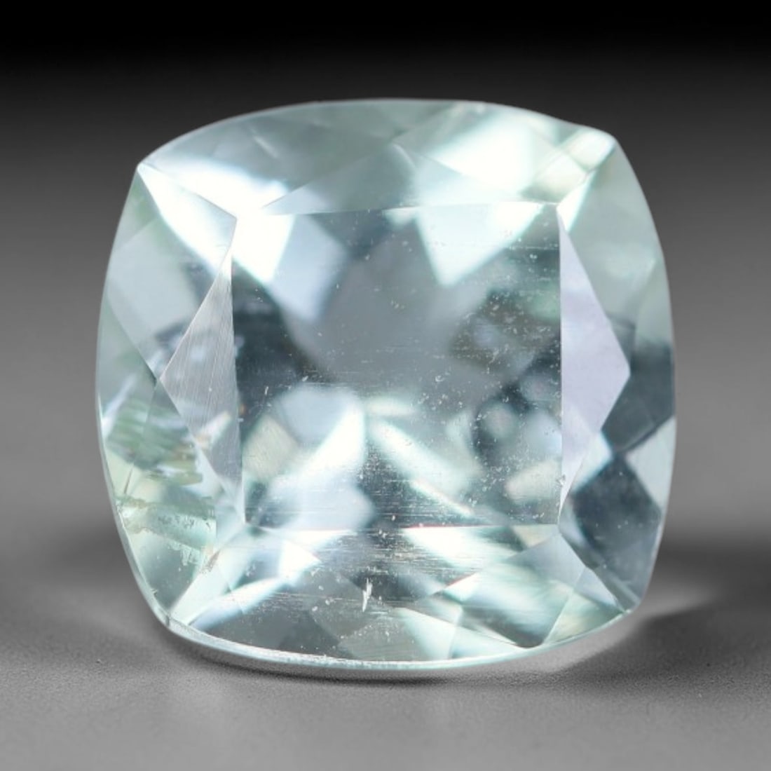 1.79ct Natural Brazilian Sky Blue Faceted Aquamarine Loose Gemstone, 98BD: This precisely faceted aquamarine boasts clear translucent pale sky blue body tone with subtle thin mineral needle and tiny scattered crystalline specks visible within its polished reflective planes i