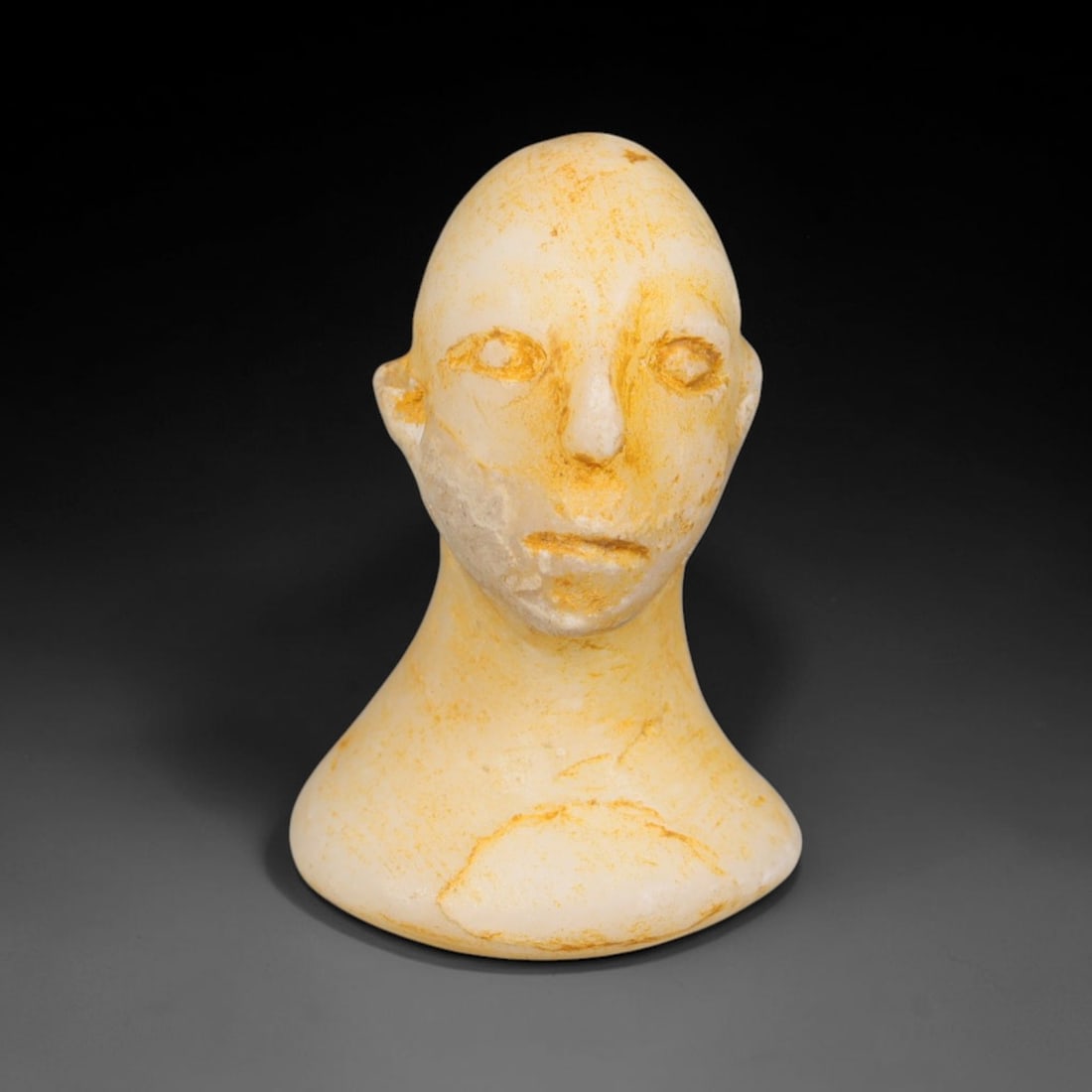 Ancient Bactrian Marble Idol Head (250 BCE-200 CE), 7EF: This carved pale marble idol head originates from Greco-Bactrian Culture, a significant Silk Road civilization blending Hellenistic and Central Asian artistic traditions. The simplified facial feature
