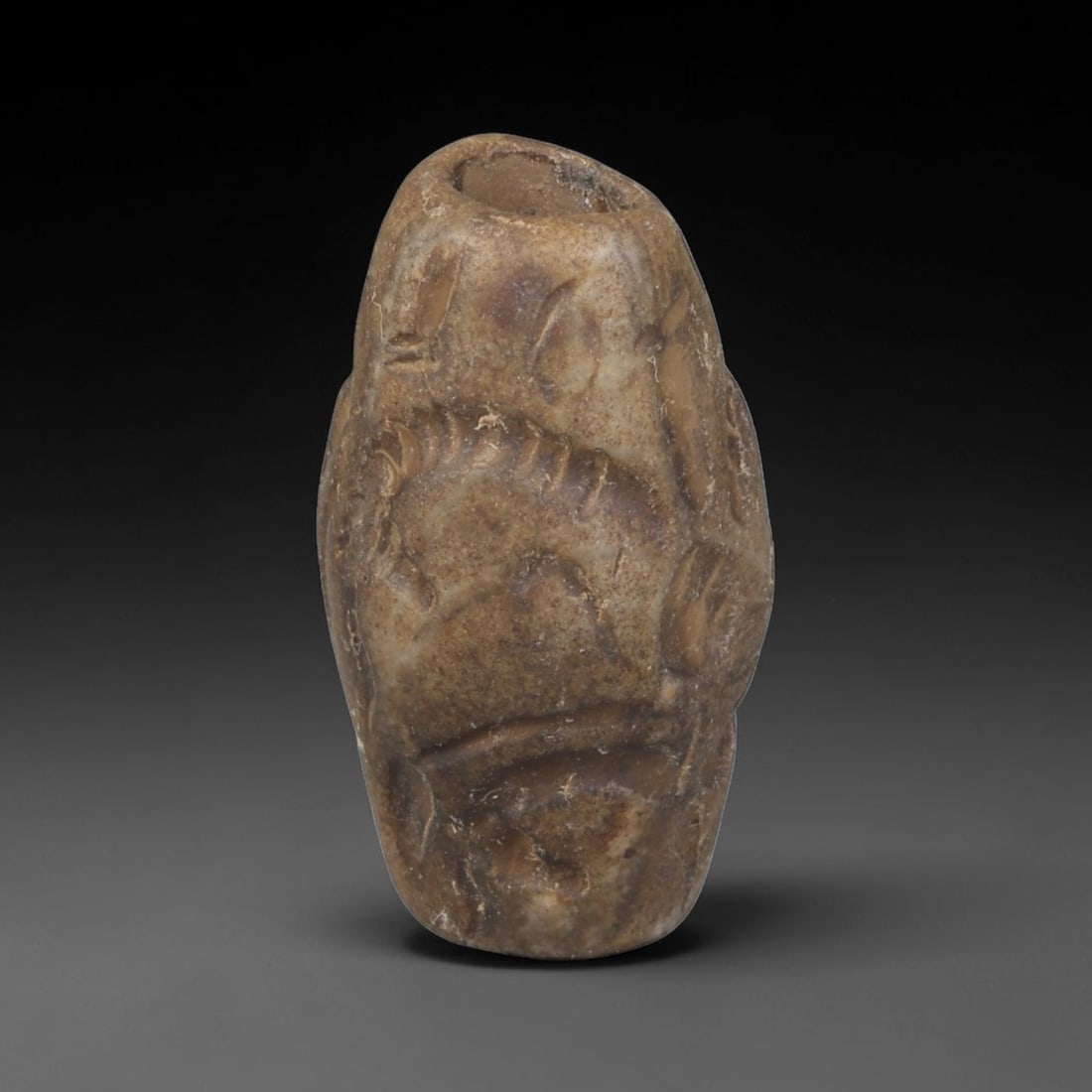 Ancient Sasanian Persian Carved Stone Cylinder Amulet (224-651 CE), 57EF: This antique carved stone cylinder amulet originates from the Sasanian Persian Empire, famed for zoomorphic talismanic carvings crafted for personal protection across late antique Western Asia. The da