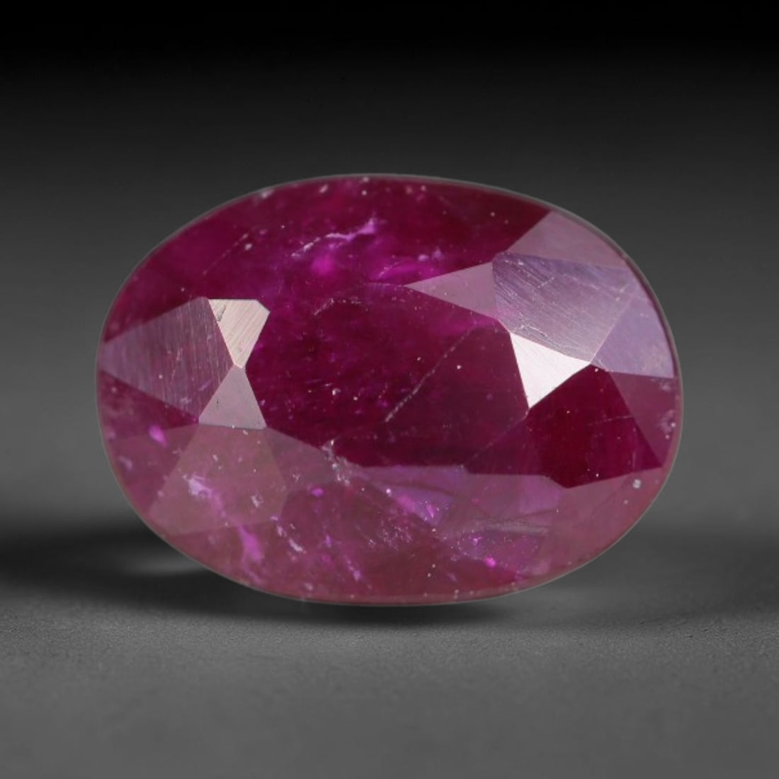 1.18ct Natural Tanzanian Longido Deep Crimson Red Faceted Ruby Loose Gemstone, 24BD: This expertly faceted Longido ruby features a rich deep crimson red body tone with distinct natural linear mineral striations, scattered pale mineral deposits and minor dark mineral flecks visible wit