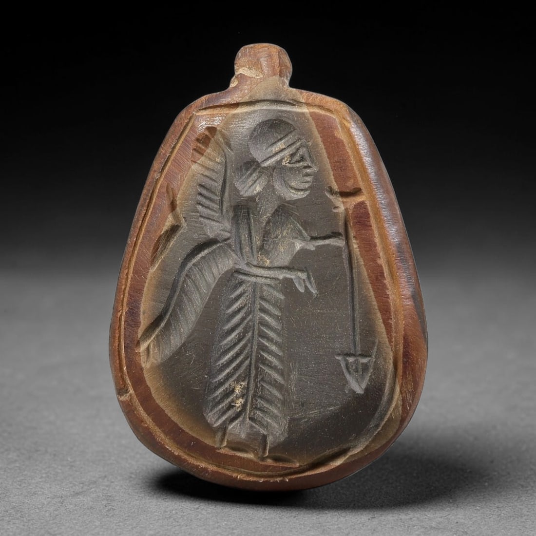 Vintage Natural Carnelian Agate Revival Indo-Persian Glyptic Figural Talisman Amulet Plaque, 70FK: This vintage talisman pendant plaque is skillfully carved from natural banded carnelian agate, crafted in a style referencing ancient Indo-Persian glyptic art traditions. The face bears detailed relie