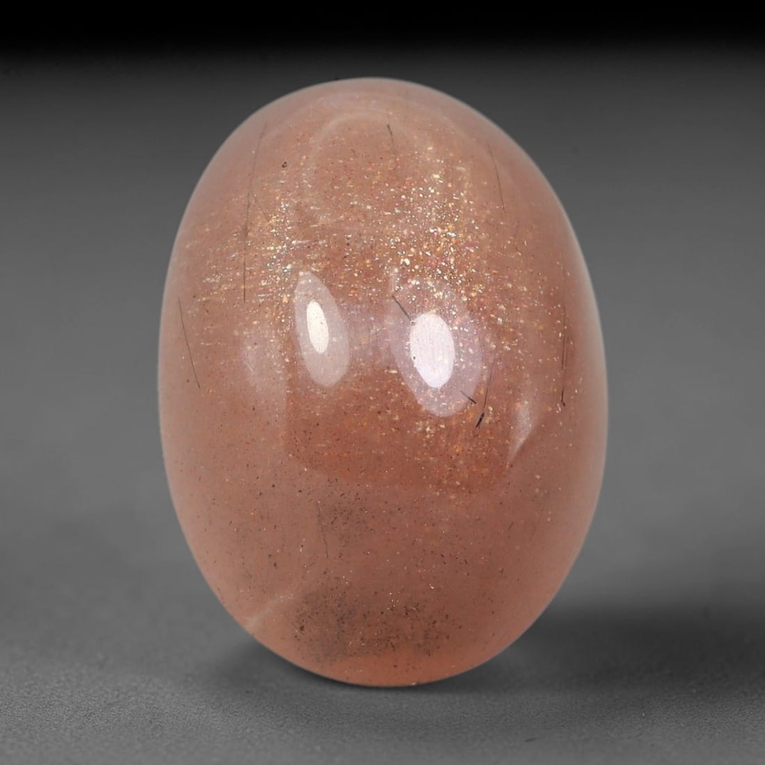14.30 Carats Natural Ceylon Warm Peach Moonstone Loose Gemstone, 88FE: This natural Ceylon moonstone has dimension measurements of 18.5x13.4x8.4mm, showcasing a smooth warm peach base tone paired with subtle soft adularescent sheen that glides gently across the polished 