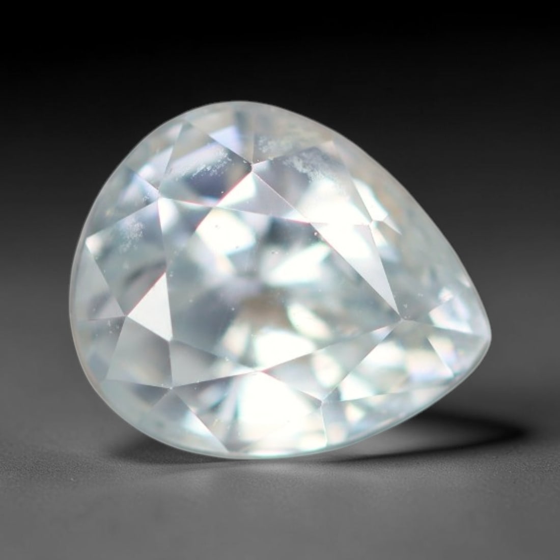 1.16ct Natural Cambodian White Zircon Loose Gemstone, 25BA: This fully polished Cambodian white zircon displays a crisp colorless transparent crystal body with faint microscopic mineral specks scattered within its high-refraction interior, measured at calibrat