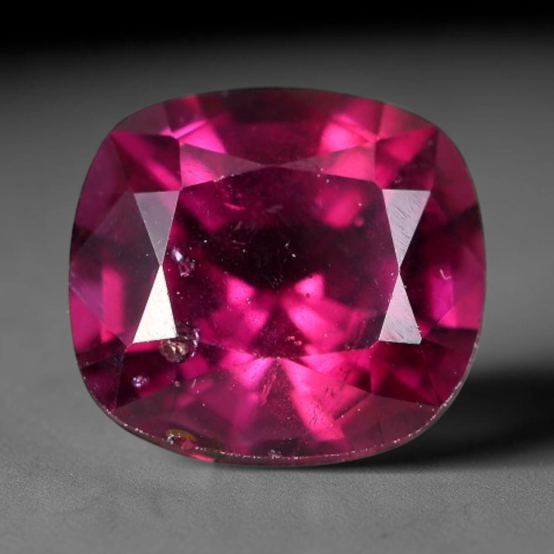 1.94 Carats Natural Mozambique Rich Raspberry Rhodolite Garnet Loose Gemstone, 42FM: This natural Mozambique rhodolite garnet holds dimension measurements of 7.3x6.7x4.7mm, carrying an intense saturated raspberry red hue that radiates vivid tonal flashes through its transparent crysta