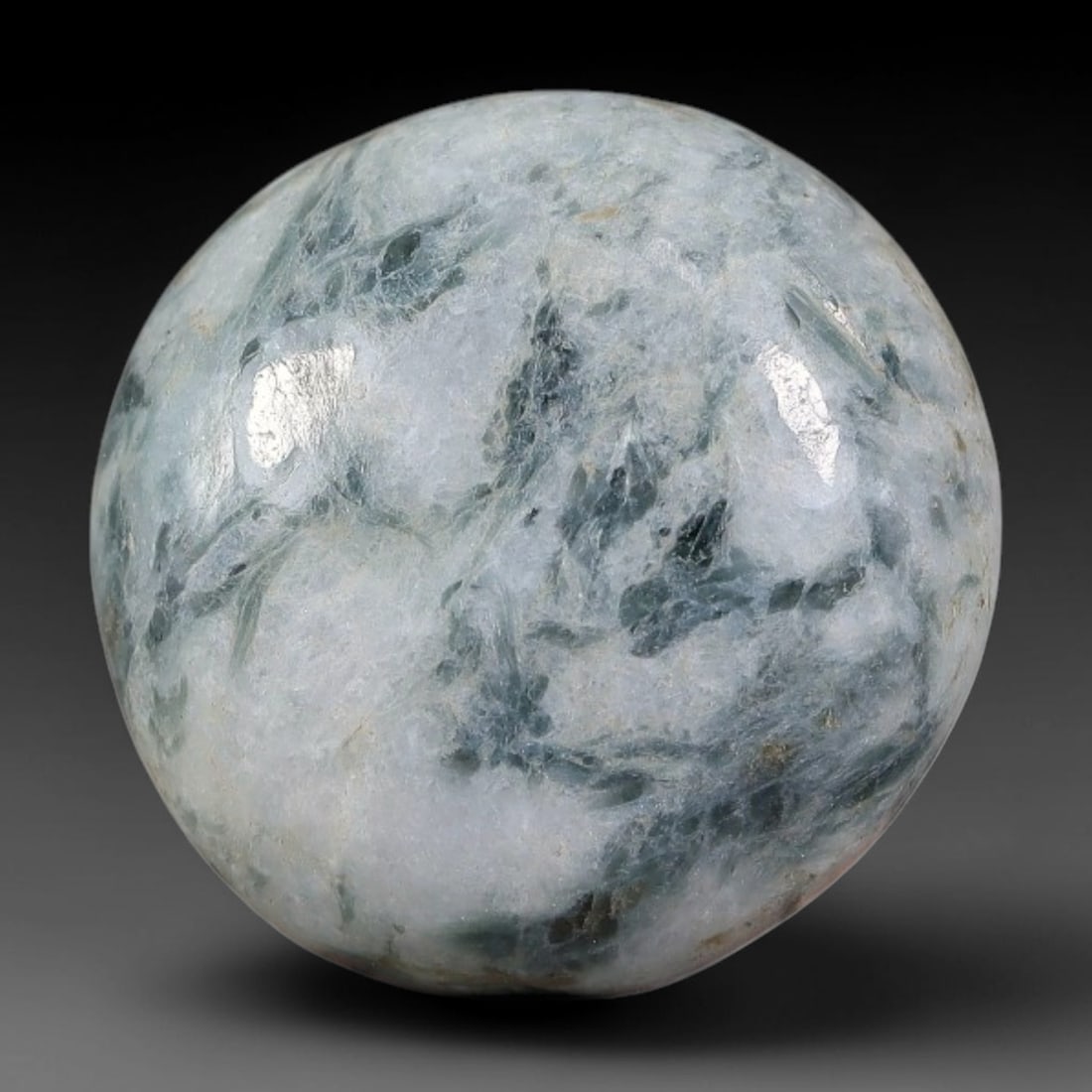 18.32ct Natural Burmese Type A Floating Blue Moss Ice Jadeite Jade Cabochon, 43FA: This single untreated natural Burmese Type A round jadeite jade cabochon weighs 18.32ct with dimensions of 18.5x18.5x6mm. It features a milky translucent ice base naturally streaked with soft blue-gre