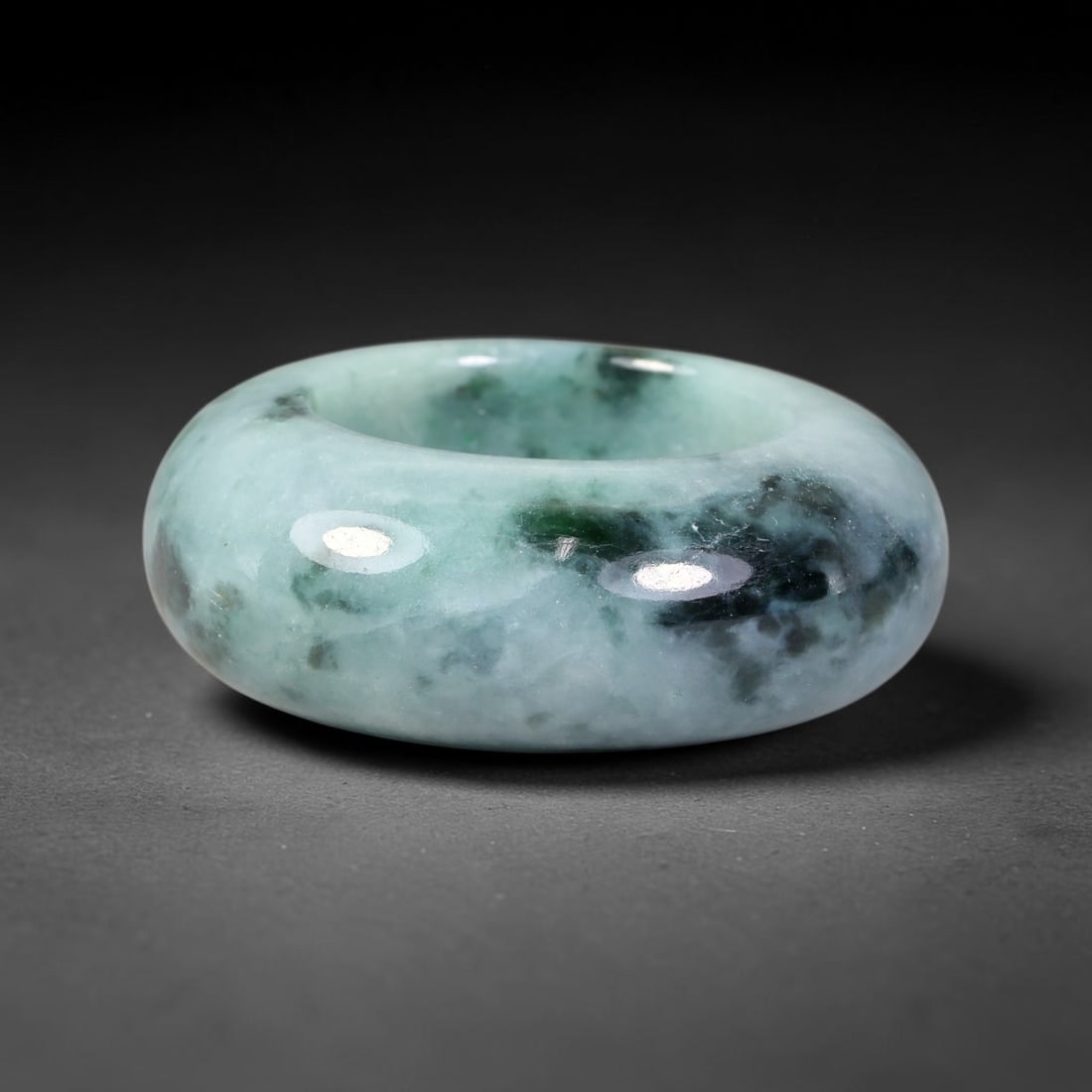 Natural Burmese Type A Jadeite Jade Wide Band Ring, 10BK: Polished untreated Burmese Type A jadeite jade wide band ring, US ring size 12.75 with a substantial band width of 13 mm. The jadeite features a soft pale mint green base naturally streaked with flowi