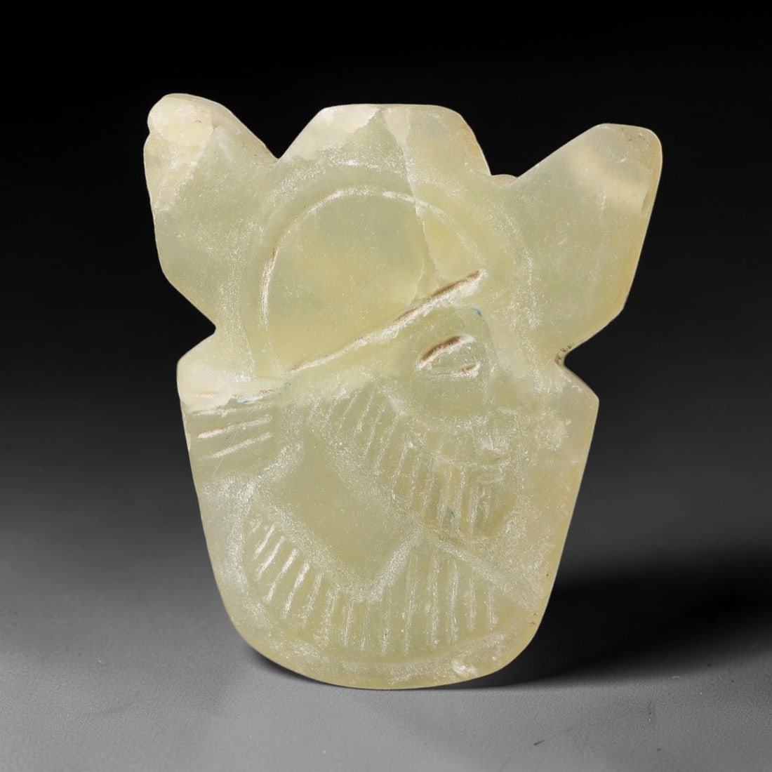 Vintage Pale Stone Sasanian Revival Figural Talisman Amulet Pendant, 24FK: This vintage carved stone amulet is crafted in revival style inspired by Sasanian glyptic art traditions. The translucent pale stone features incised detailing forming a stylised figural motif with di
