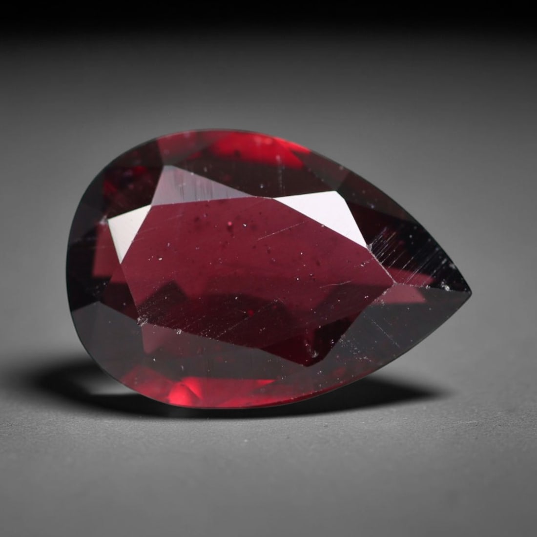 4.11ct Natural Mozambican Deep Crimson Red Faceted Almandine Garnet Loose Gemstone, 28BC: This meticulously faceted garnet features a dense, rich red crystalline body dotted with subtle micro mineral inclusions scattered evenly throughout its transparent interior, precision-cut reflective 