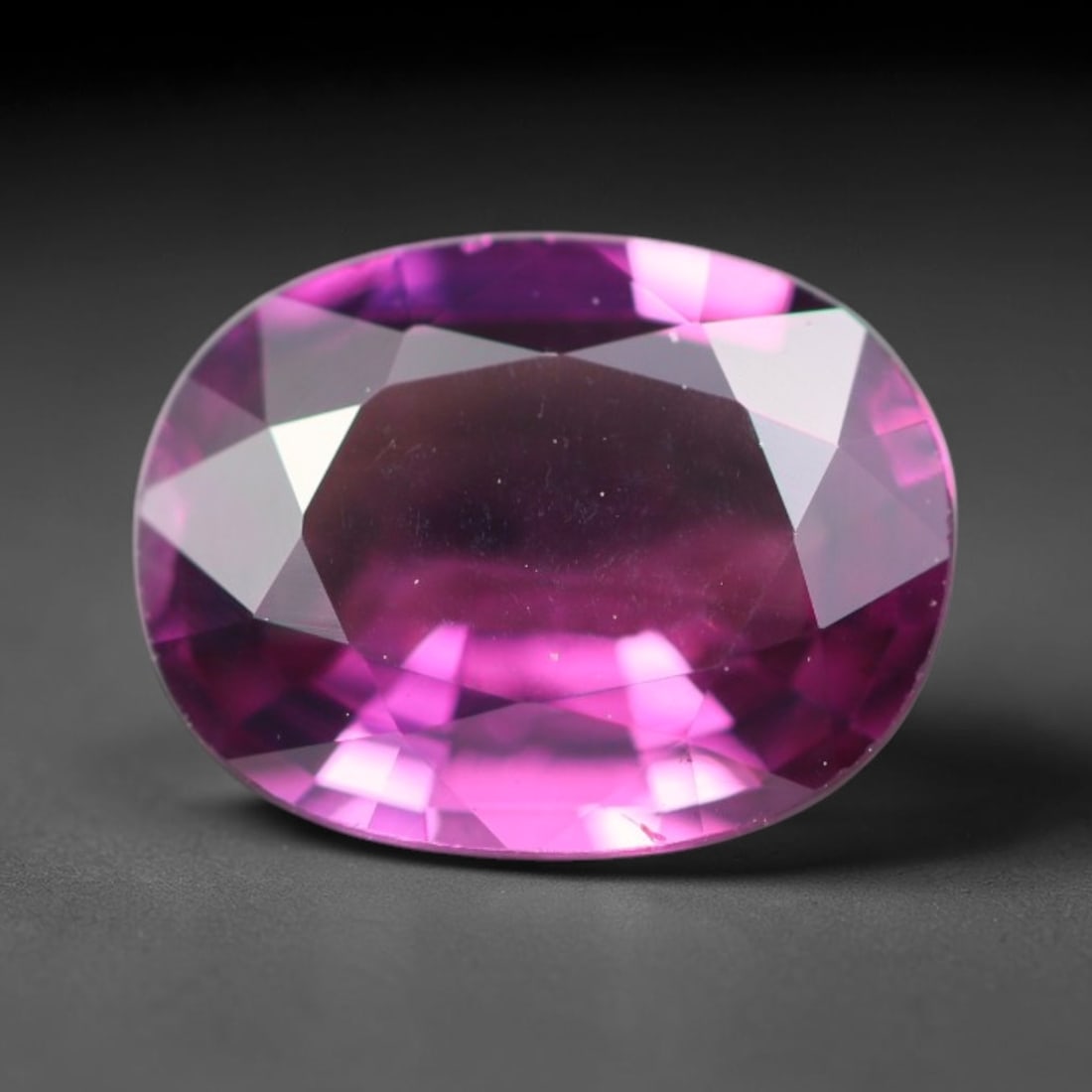 1.52ct Natural Tanzanian Rhodolite Grape Garnet Faceted Loose Gemstone, 77BA: This expertly faceted grape garnet, a scarce saturated purple-magenta rhodolite variant, features transparent crystal structure dotted with faint microscopic mineral specks within its precisely cut re