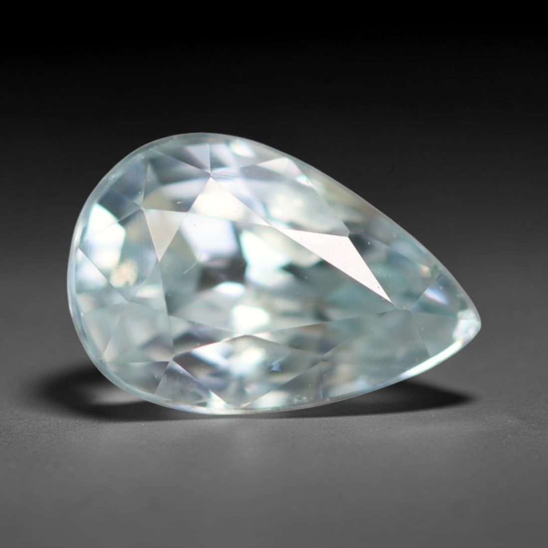 1.59ct Natural Cambodian Sky Blue Blue Zircon Loose Gemstone, 18BA: This fully polished blue zircon carries a gentle pale sky blue body tone with tiny microscopic mineral specks dispersed within its high-dispersion crystal interior, measured at calibrated dimensions o