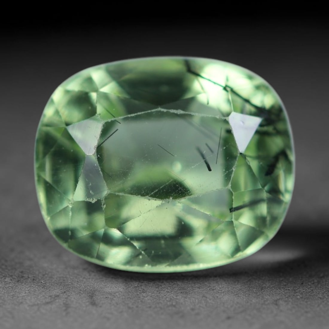 2.69 Carats Natural Pakistani Olive Green Rutilated Peridot Loose Gemstone, 91AH: This translucent peridot displays soft olive green base tone intersected by prominent thin dark needle-like rutile inclusions that create striking linear internal patterns, measured at 8.8x7.4x5.6mm. 
