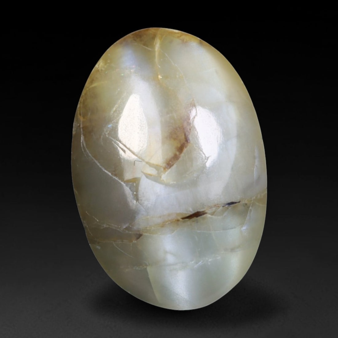 1.24 Carats Natural Ceylon Chrysoberyl Cat's Eye Loose Gemstone, 93AK: This polished Ceylon chrysoberyl cabochon displays a sharp, distinct silvery chatoyant band running across its smooth surface, formed by dense aligned microscopic rutile inclusions inherent to genuine