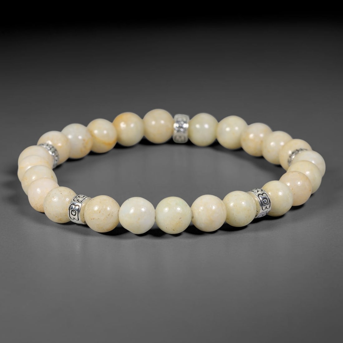 Natural Burmese Type A Jadeite Jade Beaded Bracelet, 20FJ: Crafted from polished natural jadeite jade round beads with soft creamy and pale natural tones. Each bead measures 8mm, arranged into a flexible wearable strand. Clean and elegant, this bracelet is su