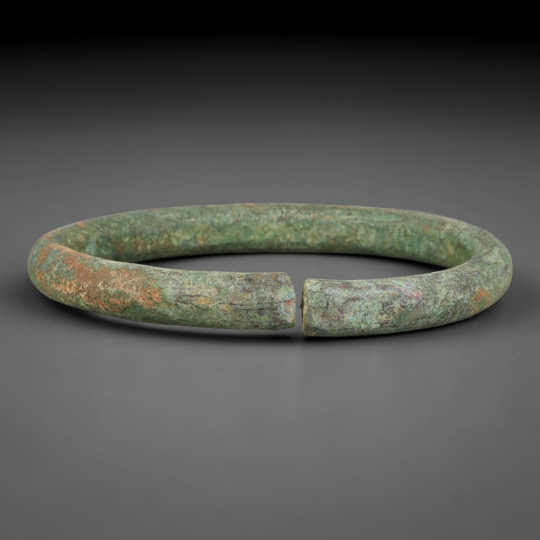 Ancient Roman Solid Bronze Bangle Bracelet, 97AC: Antique wearable circlet hand-forged from solid bronze alloy metal, originating from classical Roman provincial craft and personal adornment traditions across the ancient Mediterranean sphere. Bronze 