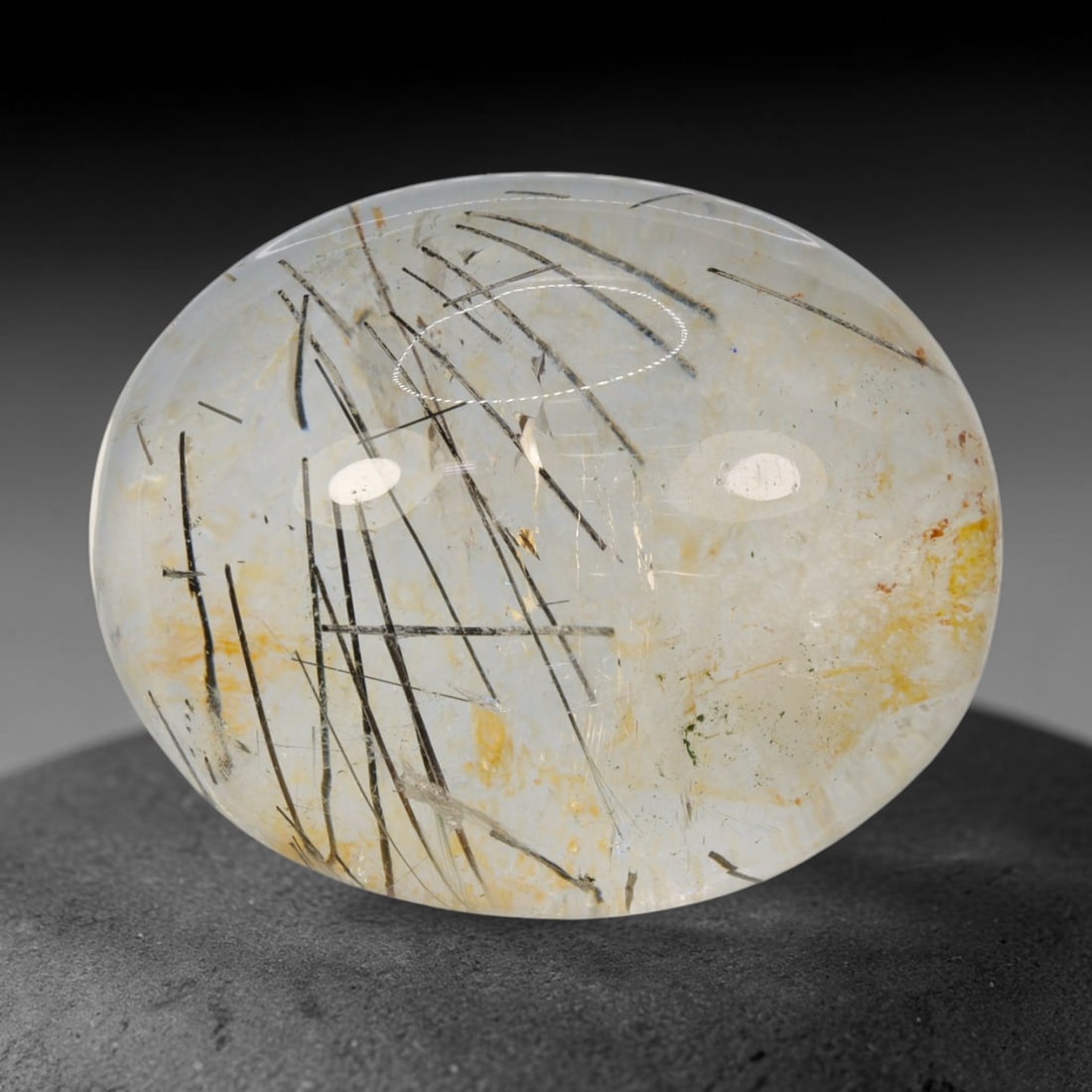 33ct Natural Brazilian Black Rutile Quartz Cabochon Loose Gemstone, 84BM: This polished cabochon of natural rutile quartz features countless distinct slender black rutile needle inclusions suspended within the clear quartz host crystal. The smooth domed surface enables full