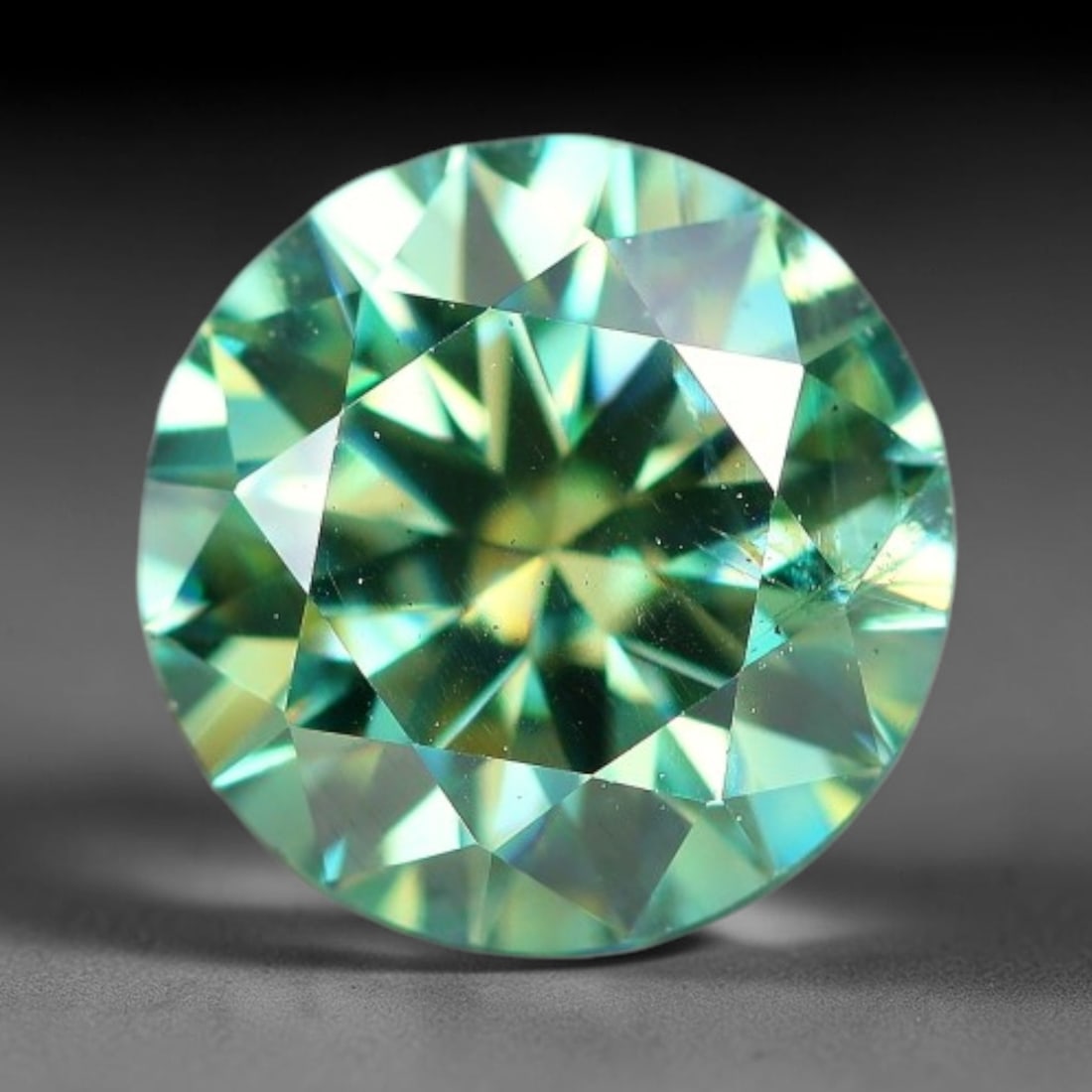 1.00 Carats Natural Teal Green Moissanite Loose Gemstone, 28FP: This lab-grown teal green moissanite measures 6.5x4mm, composed of silicon carbide with an outstanding refractive index that yields vivid, multi-hued sparkle in all lighting. Fine natural micro crysta