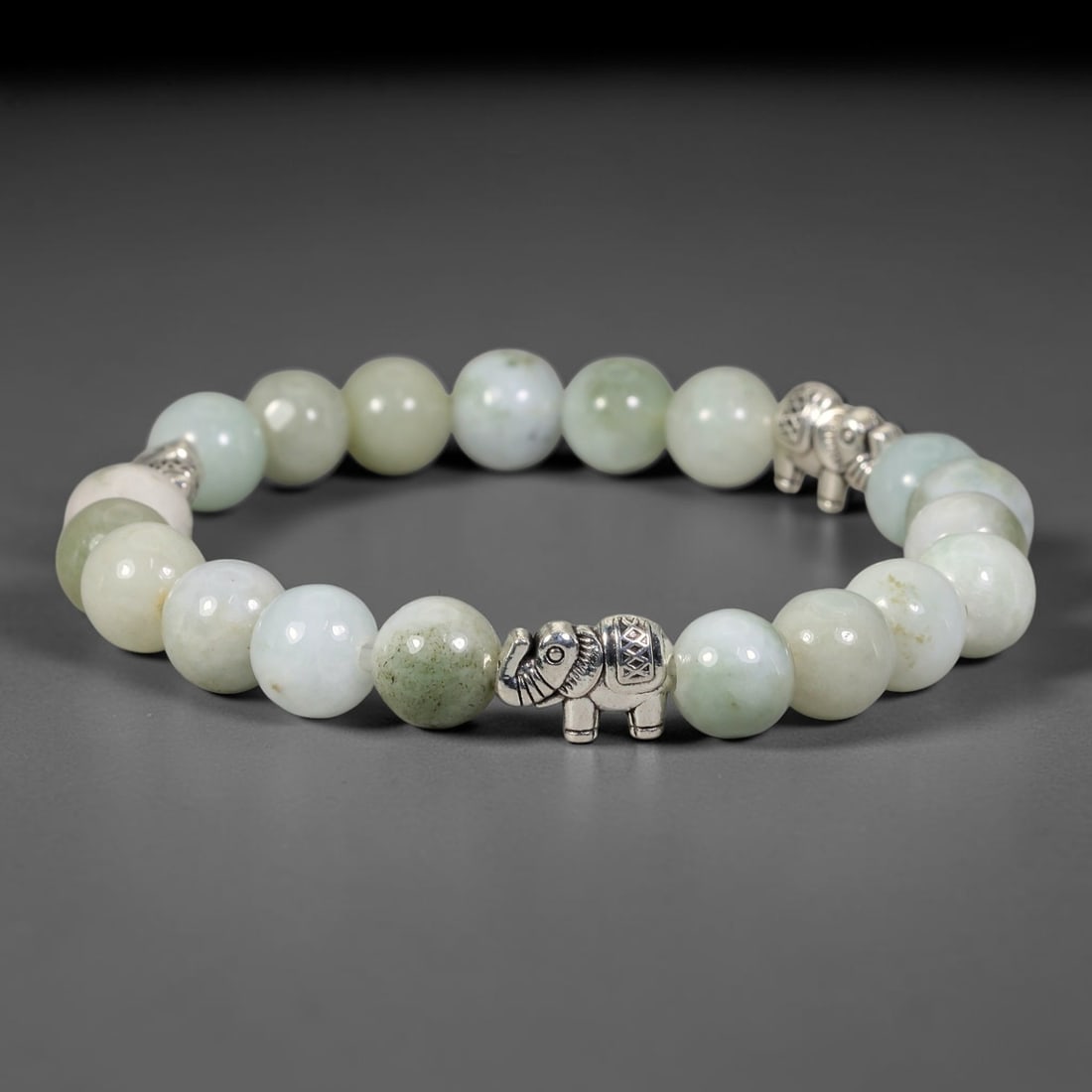 Natural Burmese Type A Jadeite Jade Beaded Bracelet, 18FJ: Constructed from polished natural jadeite jade round beads paired with decorative accent elements. The bracelet measures 8cm, assembled as a flexible wearable strand. Simple and elegant, suitable for 