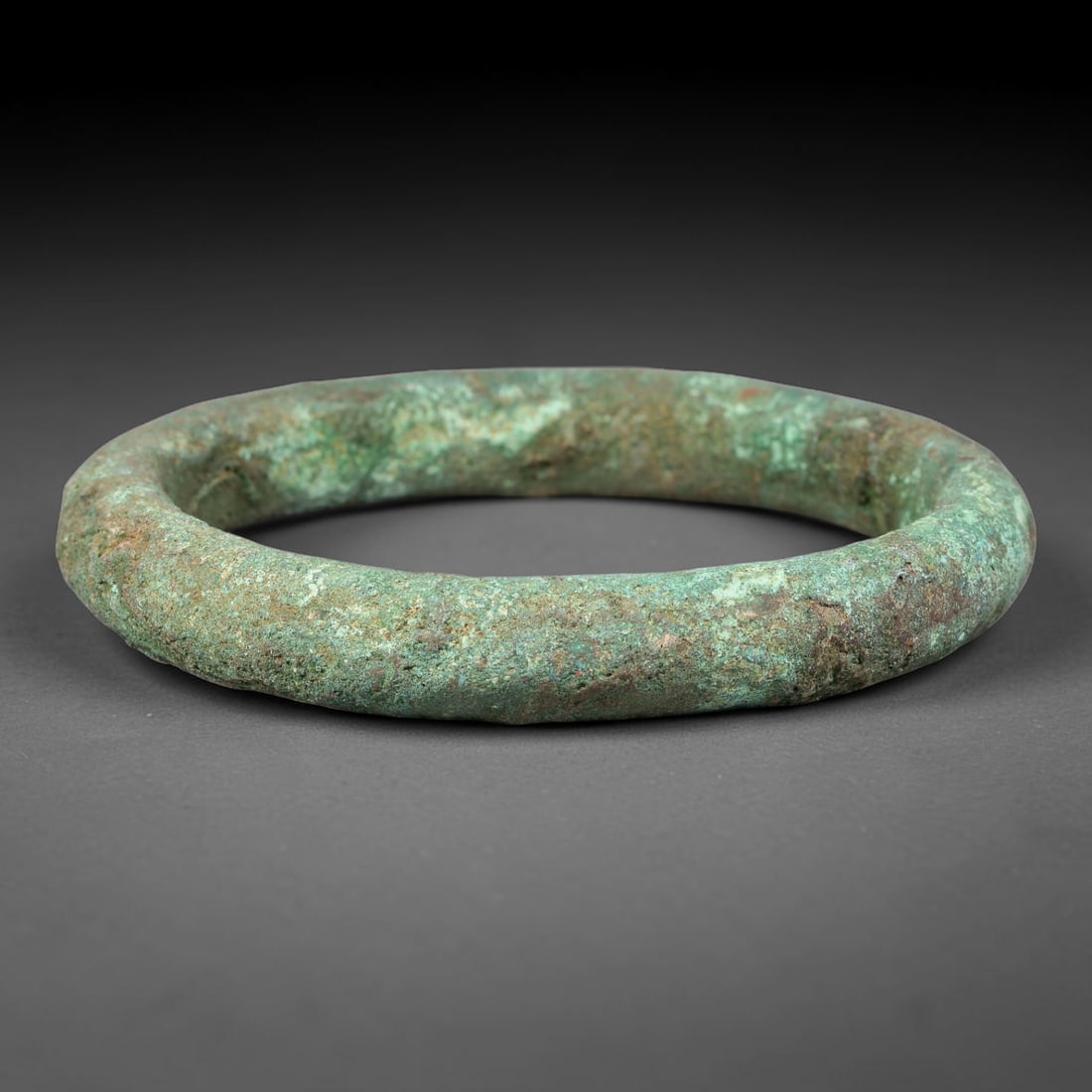Ancient Roman Republic & Imperial Roman Bronze Incised Bangle Bracelet (509 BCE-476 CE), 93AT: This antique solid bronze closed circular bangle bracelet originates from Roman Republic & Imperial Roman Culture, popular personal adornment worn by provincial Roman civilians across the Mediterranea