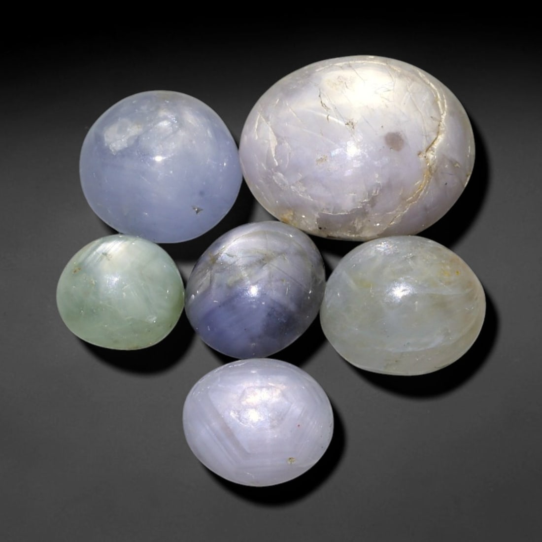 13.16ct Natural Unheated Burmese Star Sapphire Loose Gemstone Parcel, 98FL: This parcel contains natural unheated star sapphire originating from Myanmar. The gem material displays soft pale blue and lavender hues, with characteristic silk inclusions that create the desirable 