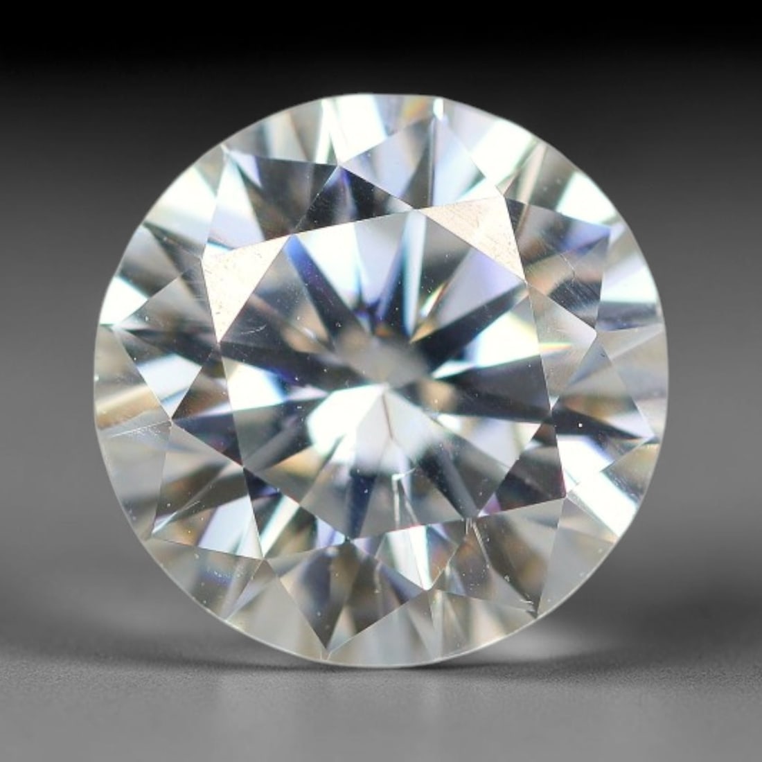 1.17 Carats Natural Cool White Moissanite Loose Gemstone, 85FM: This cool white moissanite holds dimension measurements of 7x4.2mm, delivering exceptional light dispersion that generates vivid rainbow sparkle across its fully transparent body, with faint microscop