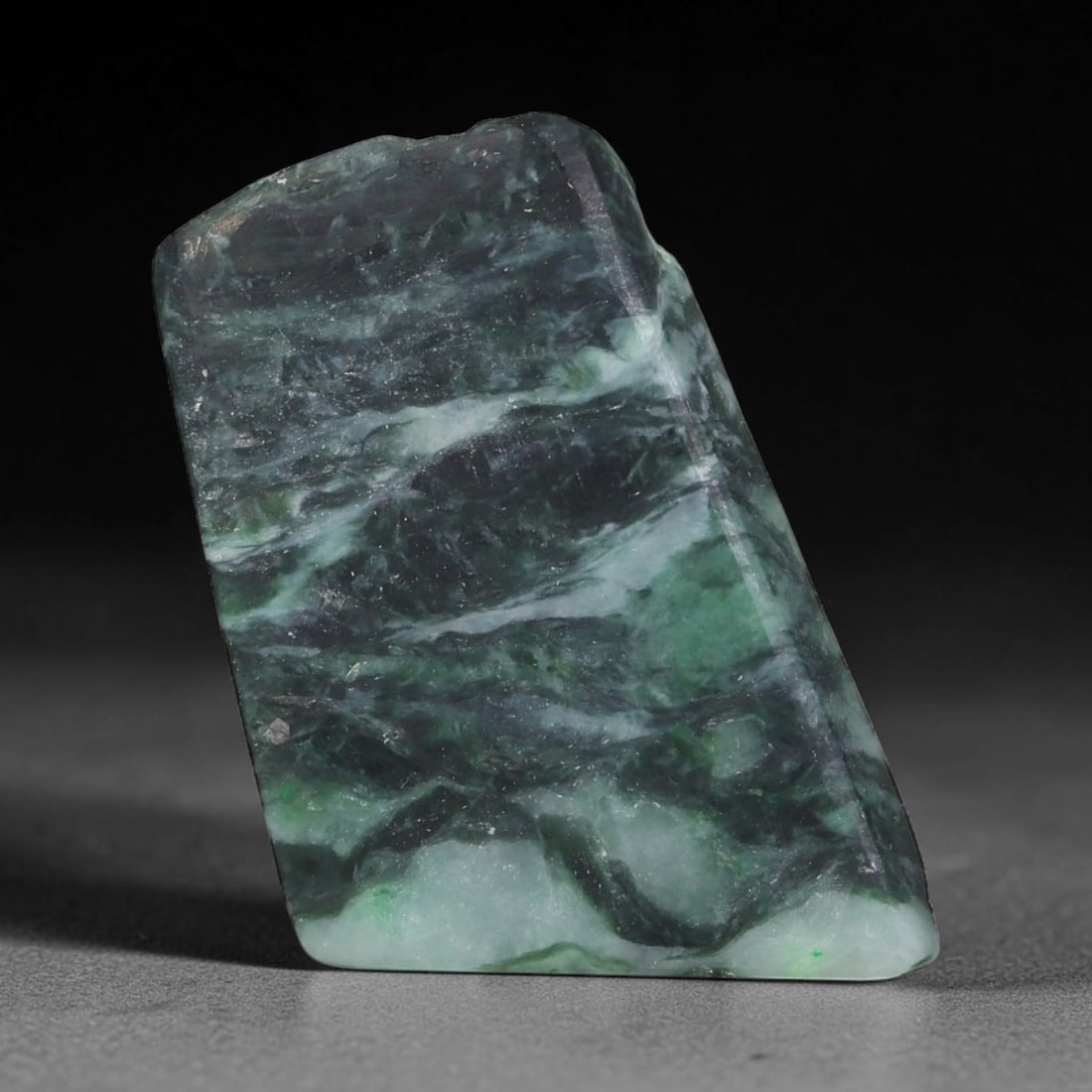 120ct Natural Type A Burmese Jadeite Jade Sliced Rough, 20FD: This specimen is a sliced rough block of natural Type A Burmese jadeite jade. The interior displays natural colour zoning with visible mineral veining and crystalline patterns typical of unprocessed j
