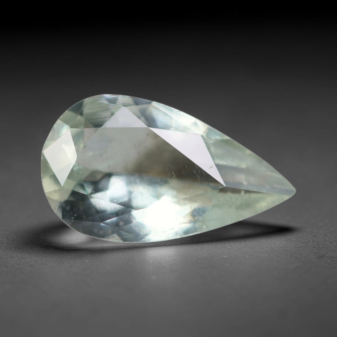 2.56ct Natural Brazilian Sky Blue Faceted Aquamarine Loose Gemstone, 15BC: This precisely faceted aquamarine boasts clear translucent pale sky blue body tone with subtle thin mineral needle and tiny scattered crystalline specks visible within its polished reflective planes i