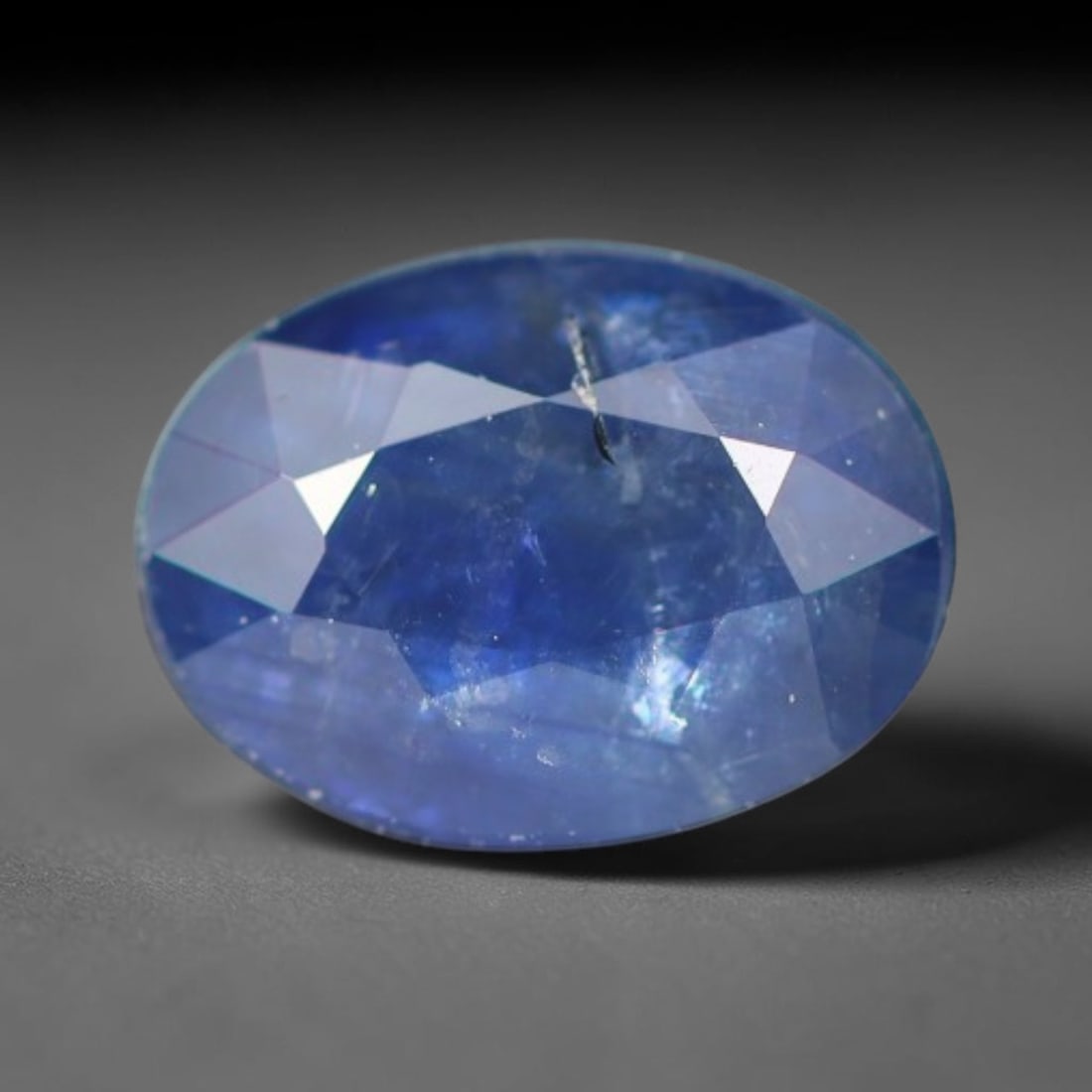 0.88ct Natural Ceylon Rich Royal Blue Faceted Blue Sapphire Loose Gemstone, 47BC: This fully polished finished sapphire displays rich saturated royal blue body tone, with fine natural microscopic mineral specks scattered throughout its transparent crystal interior within its 6.5x4.